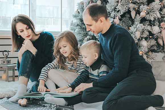 happy-family A family looking at a photo album